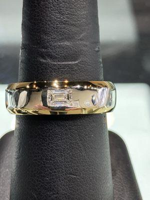 Men's band with a matching emerald cut Diamond