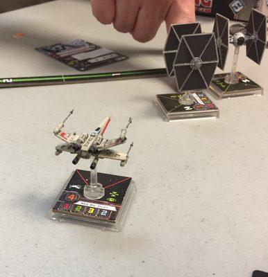 My son's X-Wing is about to blast at least one of the owner's TIE fighters!