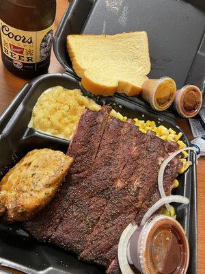 Ribs Plate with Mac & Cheese, corn and I added a chicken breast. With a  Coors on the side. Amazingly delicious meal.