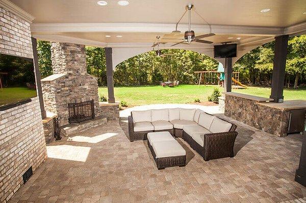 Outdoor patio, fire place, entertainment area.