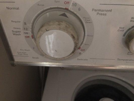 Grease covering washing machine knobs; also left by careless technicians.