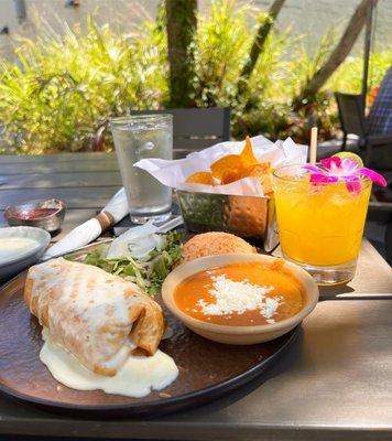 Shredded Chicken chimichanga with refried beans and rice. Mango margarita on the rocks.