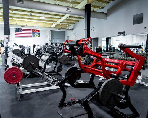 Pendulum Squat Machine: This machine is designed to mimic the natural movement of squats while providing support and safety!