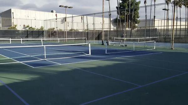 Pickleball - set up nets blue lined courts