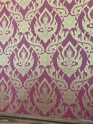 Awesome Buddha style wallpaper throughout restaurant.