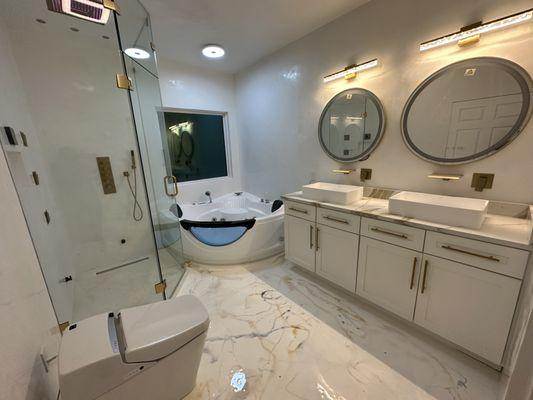 After renovations included apoxy floor, marmolina shower waterproofing, Venetian plaster finished walls , quartz countertop