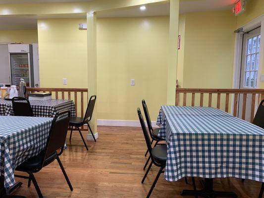 The SHWE restaurant with yellow walls. Clean and inviting.