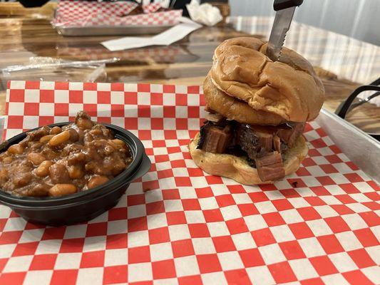 Brisket sandwich with a side of cowboy beans