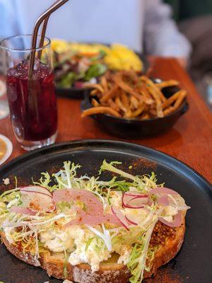 Avocado toast, African bissap drink, truffle fries, and omelette