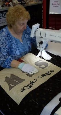 Sandra enjoying Viking's sit-down quilt machine