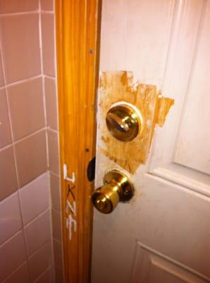 The non-functioning lock inside the filthy restroom. Truly a disgusting experience.