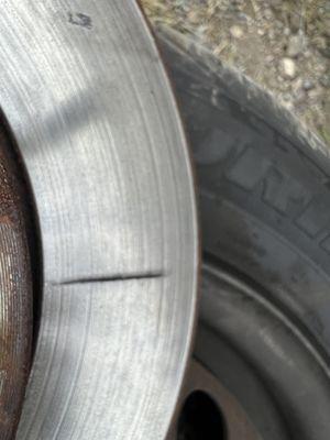 Crack in front rotor from over tightening of wheel.