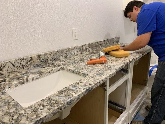 Adding a seal to the sinks.