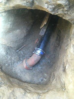 Trenchless sewer line replacement tie into city main sewer. 9ft deep!