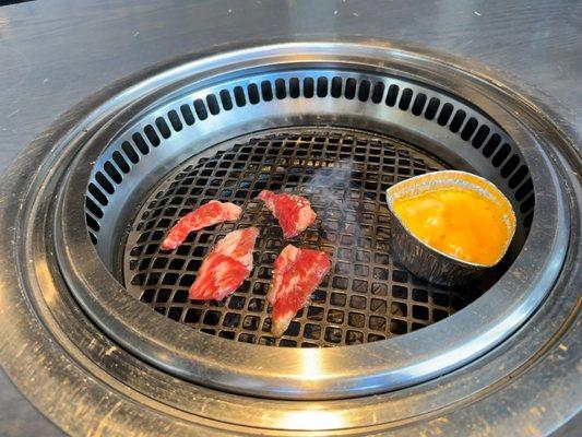 Prime Kalbi grilling with some cheese fondue heating up