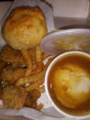 8 piece shrimp, french fries, mashed potatoes with brown gravy, and a biscuit.