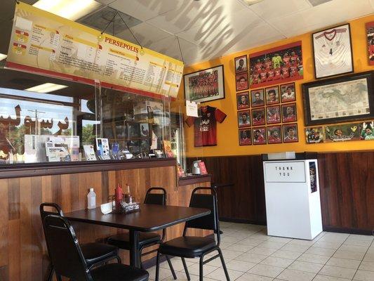 The counter and the tribute wall to the Persepolis soccer team