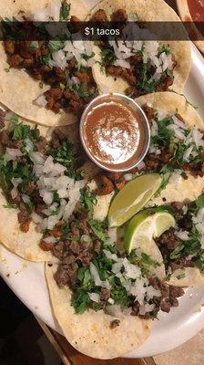 $1 street tacos for taco Tuesday! Carne asada and al pastor.