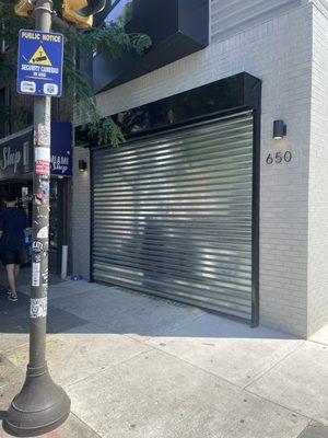 Storefront roll up gate installed by citywide team