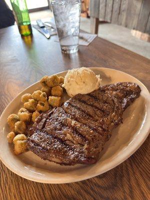 Ribeye steak with fried okras and mashed potatoes. Perfectly cooked medium rare!