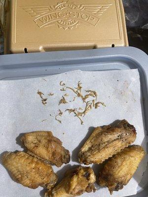 Feathers pulled out of the oily under-seasoned lemon pepper wings.