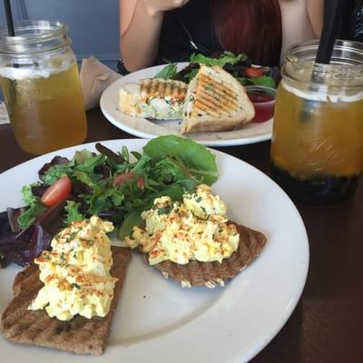 Open faced egg truffle sandwich with mango green tea and boba