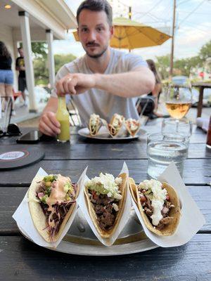 Shrimp tempura, carne asada, crispy pork (and my buddy in the background