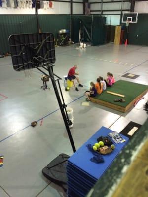 Coach Ed teaching Softball.