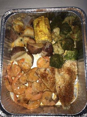 #22  1/2lb of shrimp, 1/2lb of perch . You can get it with your choice of fish. Broccoli, corn and potatoes