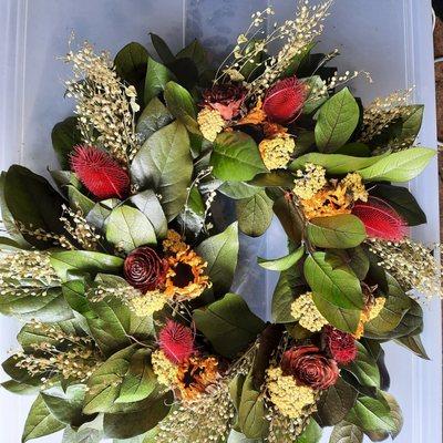 Preserved salal Wreath with dried Yarrow, sunflowers, thistle, cedar roses and pepper grass.