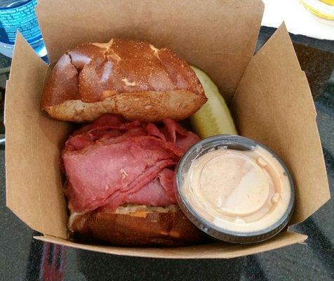 Reuben sandwich on a pretzel bun