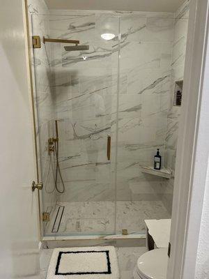 Ultra clear glass shower door with diamond fusion coating for water repellant and satin brass hardware