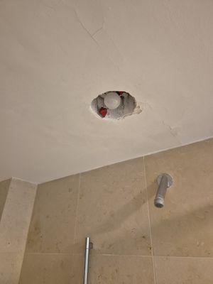 no light fixture or shower fixture, just the pipe coming out of the wall!