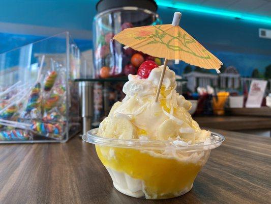 Aloha sundae. Vanilla ice cream, pineapple sauce, banana wheels, coconut flakes, whip & cherry!