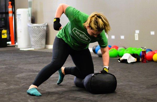 Lada landing some ground and pound on our grappling bag