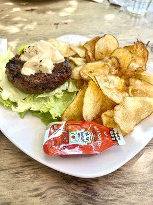 Truffle Rosemary Burger without the bun. Melted brie on top