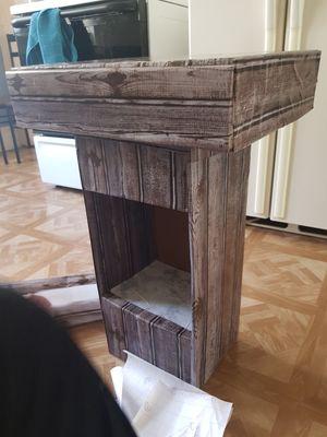 side table made with card boxes and some papers. it is completely functional.