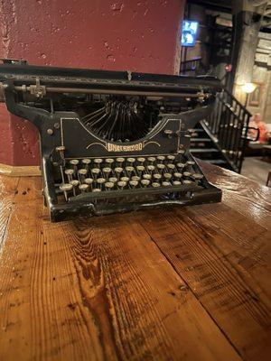 This is the type writer that Lincoln wrote the Gettysburg Address on. Totally kidding- but it is an oldie with paper still in it.