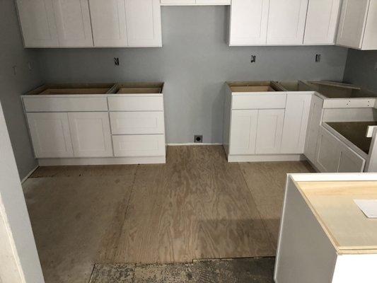 Kitchen cabinets before navy blue repaint.