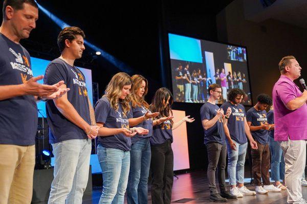 CrossCity church prays over short-term South Korea missions team before their departure from the states.