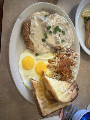 Country fried steak with sausage gravy