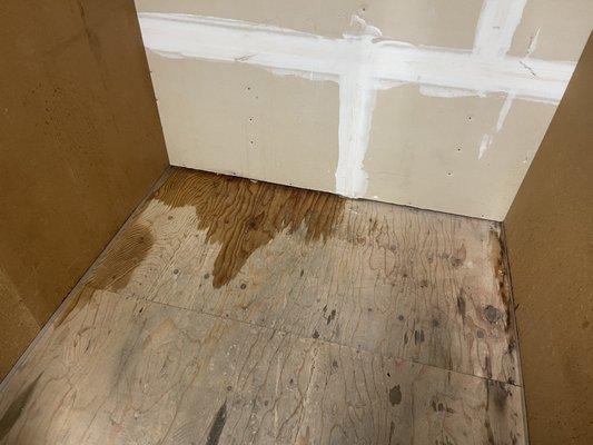 Interior of my storage unit showing leaks and a damp floor after the rain.