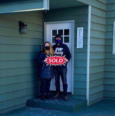 My boyfriend and me in front of our new home!