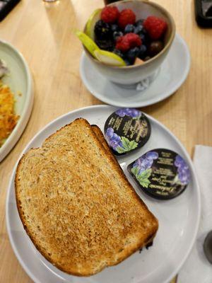 Wheat toast, and a fruit medley