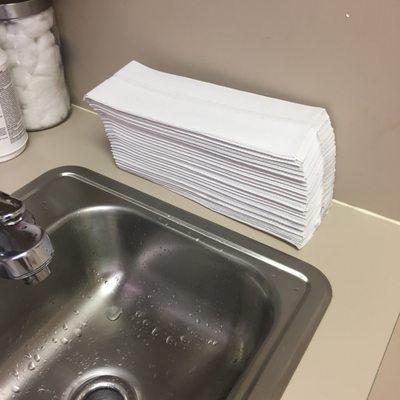 Why are the paper towels just out in the open directly next to the sink..?The bottom of the stack is clearly taking the splash from the sink