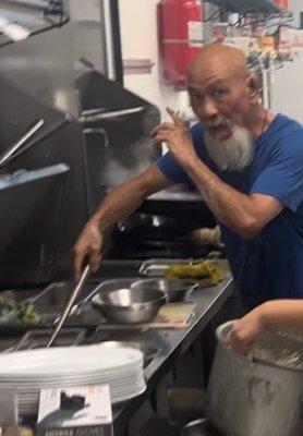 The master revealing an ancient Chinese secret about cooking.