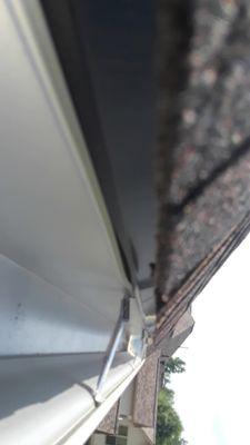 Incorrectly installed drip edge and bent drip edge.