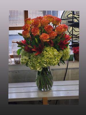 CITRUS LOVE 24 orange roses, hydrangeas and lilies. Perfect for parties,  anniversary,  happy birthday,  love, etc.