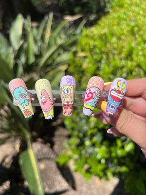 Hand painted nail art of Spangebob characters