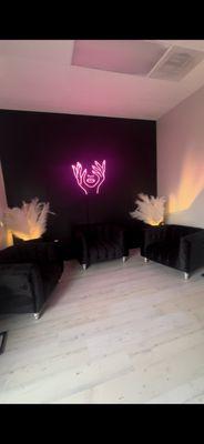 Our amazing waiting room where you can enjoy snacks and drinks while waiting for your esthetician.